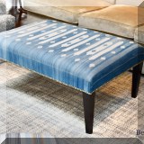F17. Cocktail ottoman with blue and white southwest style upholstery. 19”h x 42”w x 30”d 